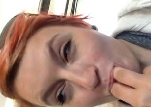 Nasty redhead plays with her vagina in a public bus